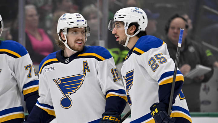 Dec 14, 2024; Dallas, Texas, USA; St. Louis Blues defenseman Justin Faulk (72) and center Robert Thomas (18) and center Jordan Kyrou (25) in action during the game between the Dallas Stars and the St. Louis Blues at American Airlines Center. Mandatory Credit: Jerome Miron-Imagn Images