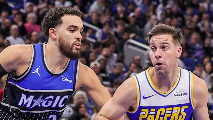 Indiana Pacers guard T.J. McConnell moves the ball in front of Orlando Magic guard Tyus Jones.