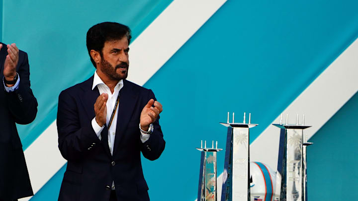 May 8, 2022; Miami Gardens, Florida, USA; Dan Marino and FIA president Mohammed Ben Sulayem applaud during the award ceremony following the Miami Grand Prix at Miami International Autodrome. Mandatory Credit: John David Mercer-Imagn Images