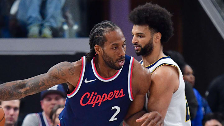 Apr 24, 2025; Inglewood, California, USA; Los Angeles Clippers forward Kawhi Leonard (2) moves to the basket against Denver Nuggets guard Jamal Murray (27) during the first half of game three in the first round for the 2024 NBA Playoffs at Intuit Dome.