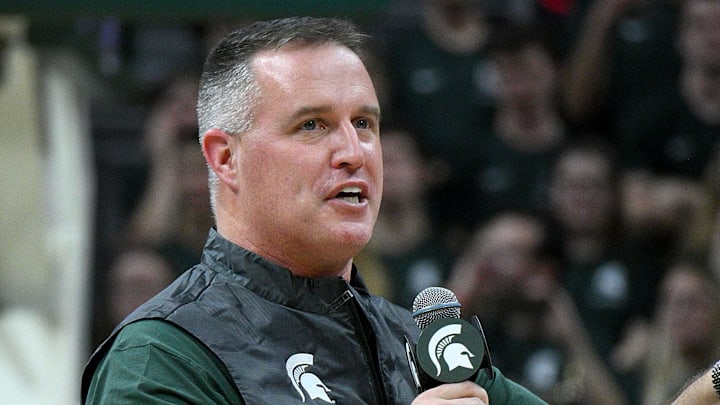 Dec 2, 2025; East Lansing, Michigan, USA;  Michigan State head football coach Pat Fitzgerald watches the Spartans defeat the Iowa Hawkeyes at Jack Breslin Student Events Center. Mandatory Credit: Dale Young-Imagn Images