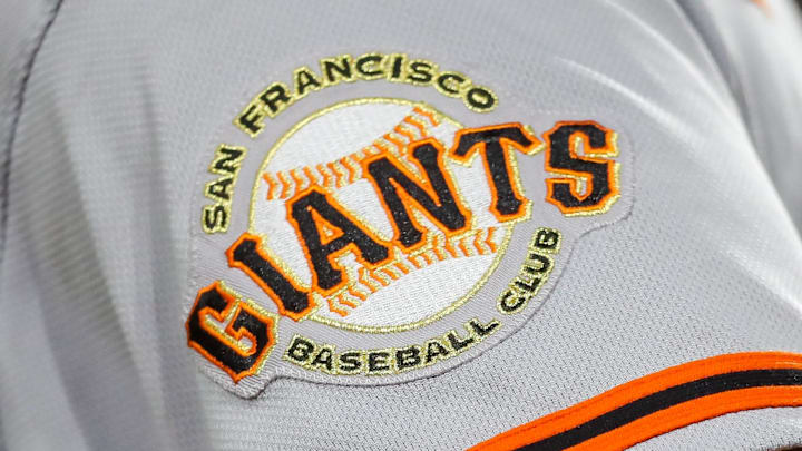 The San Francisco Giants logo on the sleeve of a player during a game. The San Francisco Giants logo on the sleeve of a player during a game.