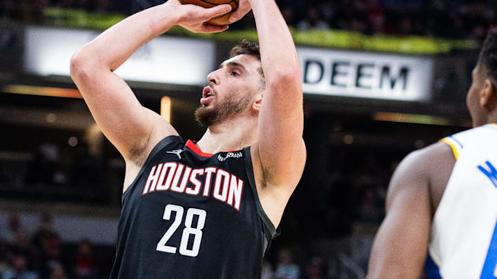 Feb 2, 2026; Indianapolis, Indiana, USA; Houston Rockets center Alperen Sengun (28) shoots the ball while Indiana Pacers guard/forward Aaron Nesmith (23) defends in the first half at Gainbridge Fieldhouse. Mandatory Credit: Trevor Ruszkowski-Imagn Images