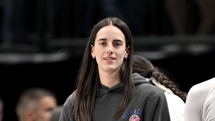 Jun 27, 2025; Dallas, Texas, USA; Indiana Fever guard Caitlin Clark (22) looks on from the team bench during the game against the Dallas Wings at the American Airlines Center. Mandatory Credit: Jerome Miron-Imagn Images