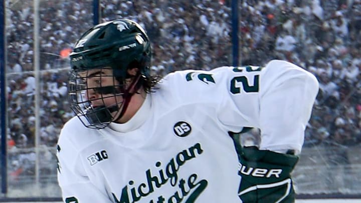 Jan 31, 2026; State College, PA, USA; Michigan State Spartans forward Porter Martone (22) moves the puck against Penn State Nittany Lions defenseman Jackson Smith (7) during the second period at Beaver Stadium. Mandatory Credit: Matthew O'Haren-Imagn Images Jan 31, 2026; State College, PA, USA; Michigan State Spartans forward Porter Martone (22) moves the puck against Penn State Nittany Lions defenseman Jackson Smith (7) during the second period at Beaver Stadium. Mandatory Credit: Matthew O'Haren-Imagn Images