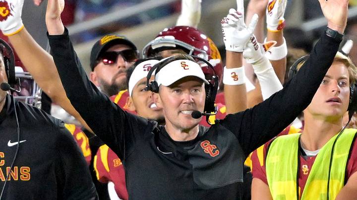 USC Trojans head coach Lincoln Riley and defensive line coach Shaun Nua celebrate on the sideline USC Trojans head coach Lincoln Riley and defensive line coach Shaun Nua celebrate on the sideline