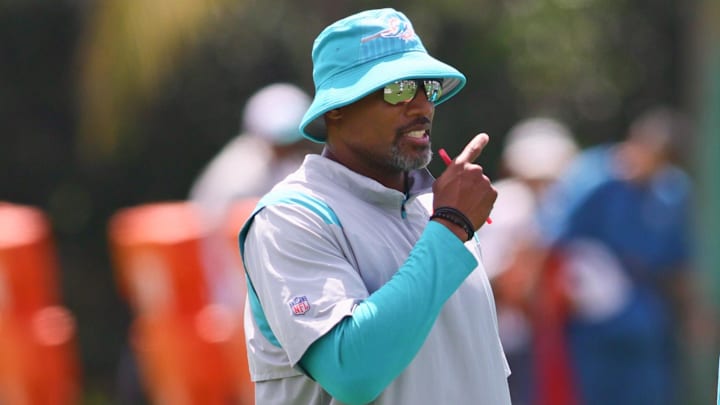 Jun 4, 2024; Miami Gardens, FL, USA; Miami Dolphins defensive coordinator Anthony Weaver talks to cornerback Jalen Ramsey (5) during mandatory minicamp at Baptist Health Training Complex. Mandatory Credit: Sam Navarro-Imagn Images