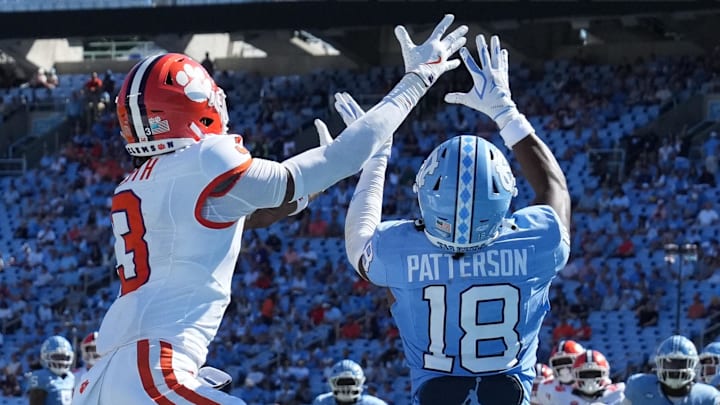 Oct 4, 2025; Chapel Hill, North Carolina, USA; North Carolina Tar Heels defensive back Jaiden Patterson (18) breaks up a pass intended for Clemson Tigers wide receiver Tristan Smith (3) in the fourth quarter at Kenan Stadium. Mandatory Credit: Bob Donnan-Imagn Images Oct 4, 2025; Chapel Hill, North Carolina, USA; North Carolina Tar Heels defensive back Jaiden Patterson (18) breaks up a pass intended for Clemson Tigers wide receiver Tristan Smith (3) in the fourth quarter at Kenan Stadium. Mandatory Credit: Bob Donnan-Imagn Images