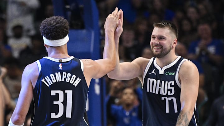 Oct 24, 2024; Dallas, Texas, USA; Dallas Mavericks guard Klay Thompson (31) and guard Luka Doncic (77) celebrate during the second half against the San Antonio Spurs at the American Airlines Center. Mandatory Credit: Jerome Miron-Imagn Images