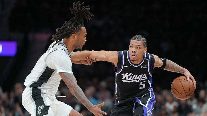 Oct 27, 2026; San Antonio, Texas, USA;  Sacramento Kings guard Darius Acuff Jr. (5) dribbles against San Antonio Spurs guard Stephon Castle (5) in the first half at Frost Bank Center.  Mandatory Credit: Daniel Dunn-Imagn Images