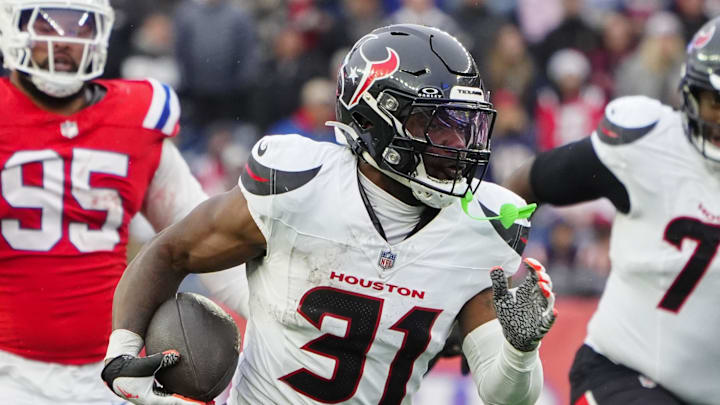 Oct 13, 2024; Foxborough, Massachusetts, USA; Houston Texans running back Dameon Pierce (31) runs with the ball for a touchdown against the New England Patriots during the second half at Gillette Stadium. Mandatory Credit: Gregory Fisher-Imagn Images