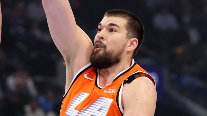 Nov 29, 2025; Inglewood, California, USA;  Los Angeles Clippers center Ivica Zubac (40) shoots the ball over Dallas Mavericks forward/center Dwight Powell (7) during the first quarter at Intuit Dome. Mandatory Credit: Kiyoshi Mio-Imagn Images