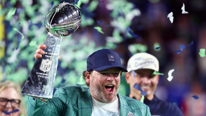 Seattle Seahawks general manager and former Packers executive John Schneider celebrates with the Vince Lombardi Trophy.