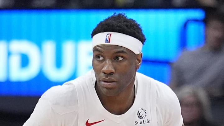 Toronto Raptors guard Ja'Kobe Walter dribbles up the court against the Detroit Pistons.