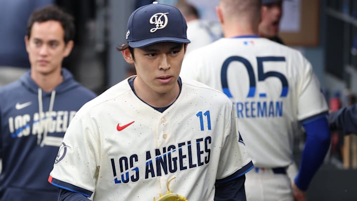 Apr 25, 2026; Los Angeles, California, USA; Los Angeles Dodgers starting pitcher Roki Sasaki (11) walks in the dugout after the first inning against the Chicago Cubs at Dodger Stadium. Mandatory Credit: Kiyoshi Mio-Imagn Images