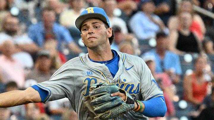 Jun 17, 2025; Omaha, Neb, USA;  UCLA Bruins shortstop Roch Cholowsky (1) throws to first base against the Arkansas Razorbacks during the third inning at Charles Schwab Field. Mandatory Credit: Steven Branscombe-Imagn Images