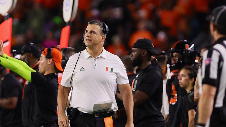 Oct 26, 2024; Miami Gardens, Florida, USA; Miami Hurricanes head coach Mario Cristobal watches from the sideline against the Florida State Seminoles during the third quarter at Hard Rock Stadium. Mandatory Credit: Sam Navarro-Imagn Images
