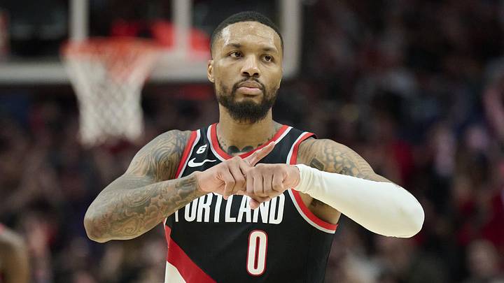 Dec 8, 2022; Portland, Oregon, USA; Portland Trail Blazers guard Damian Lillard (0) celebrates during the second half after scoring a three point basket against the Denver Nuggets at Moda Center. The Nuggets won the game 121-120. Mandatory Credit: Troy Wayrynen-Imagn Images