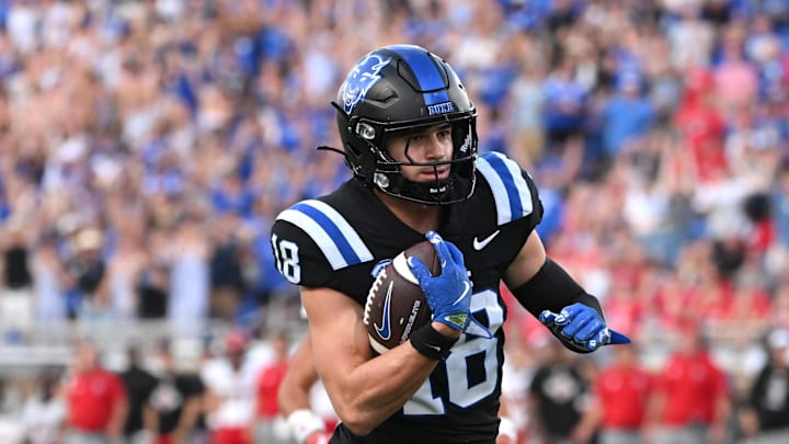 Sep 20, 2025; Durham, North Carolina, USA; Duke Blue Devils wide receiver Cooper Barkate (18) runs for a touchdown in the third quarter against the NC State Wolfpack at Wallace Wade Stadium. Mandatory Credit: Zachary Taft-Imagn Images