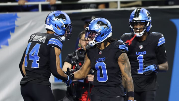 Detroit Lions Jahmyr Gibbs (0) celebrates a touchdown with wide receiver Amon-Ra St. Brown (14) Detroit Lions Jahmyr Gibbs (0) celebrates a touchdown with wide receiver Amon-Ra St. Brown (14)