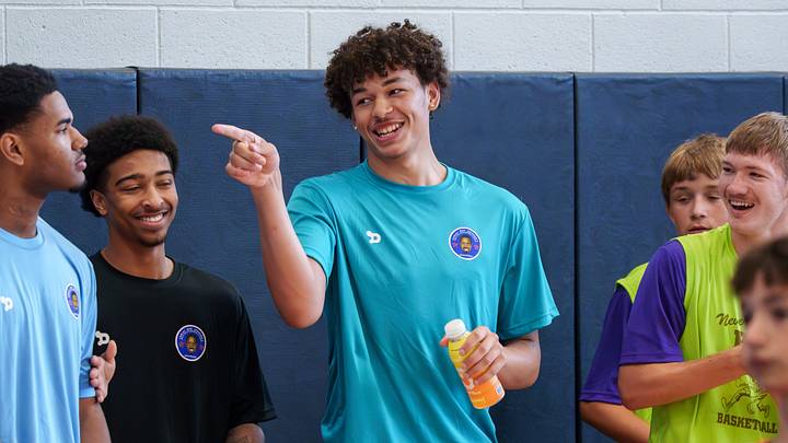 Illini commit Quinton Kitt jokes with his fellow coaches Monday, Aug. 3, 2026, during the Curley “Boo” Johnson Skills for Life Basketball Academy camps at Central School and Washington Middle School in Washington. Illini commit Quinton Kitt jokes with his fellow coaches Monday, Aug. 3, 2026, during the Curley “Boo” Johnson Skills for Life Basketball Academy camps at Central School and Washington Middle School in Washington.