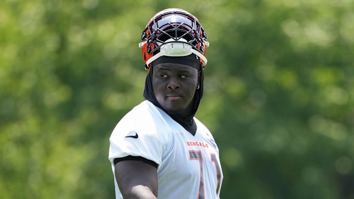 Jun 10, 2025; Cincinnati, OH, USA;  Cincinnati Bengals offensive tackle Amarius Mims (71) walks to the next drill during practice at Paycor Stadium. Mandatory Credit: Kareem Elgazzar-Imagn Images