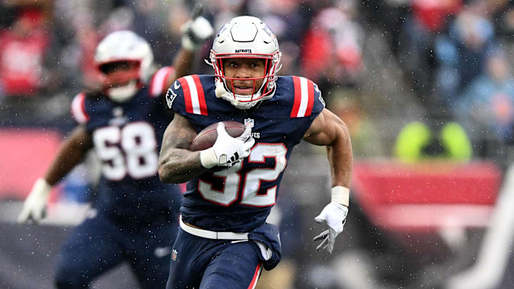 Dec 14, 2025; Foxborough, Massachusetts, USA; New England Patriots running back Treveyon Henderson (32) runs for a touchdown against the Buffalo Bills during the first half at Gillette Stadium. Mandatory Credit: Brian Fluharty-Imagn Images