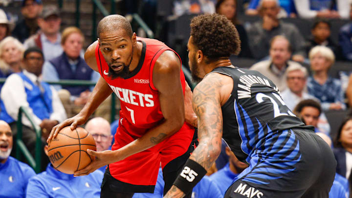 Dec 6, 2025; Dallas, Texas, USA; Houston Rockets forward Kevin Durant (7) is guarded by Dallas Mavericks forward P.J. Washington (25) during the first quarter at American Airlines Center. Mandatory Credit: Andrew Dieb-Imagn Images