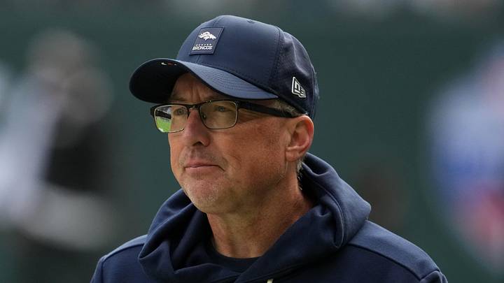 Oct 12, 2025; Tottenham, United Kingdom; Denver Broncos senior offensive assistant coach Pete Carmichael watches during an NFL International Series game against the New York Jets at Tottenham Hotspur Stadium. Mandatory Credit: Kirby Lee-Imagn Images