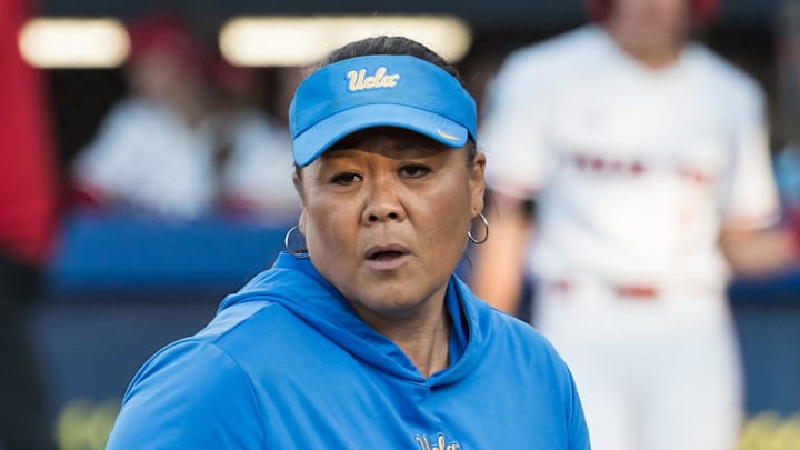 May 31, 2025; Oklahoma City, OK, USA; UCLA Bruins head coach Kelly Inouye-Perez walks back to the dugout in the sixth inning against the Texas Tech Red Raiders during the NCAA Softball Women's College World Series at Devon Park. Mandatory Credit: Brett Rojo-Imagn Images