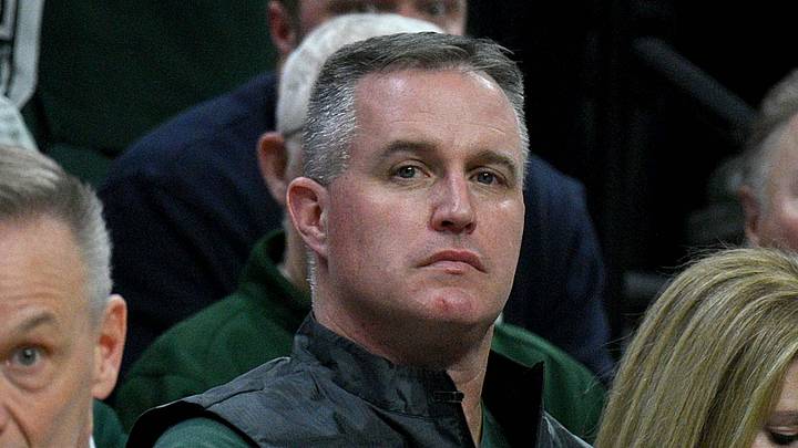 Dec 2, 2025; East Lansing, Michigan, USA;  Michigan State head football coach Pat Fitzgerald watches the Spartans defeat the Iowa Hawkeyes at Jack Breslin Student Events Center. Mandatory Credit: Dale Young-Imagn Images