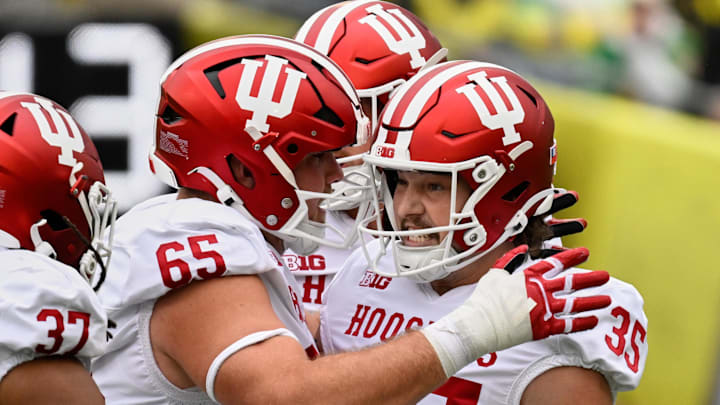 Oct 11, 2025; Eugene, Oregon, USA; Indiana Hoosiers placekicker Brendan Franke (35) celebrates with offensive lineman Carter Smith (65) and tight end Riley Nowakowski (37) after kicking a 58-yard field goal against the Oregon Ducks during the second quarter at Autzen Stadium.