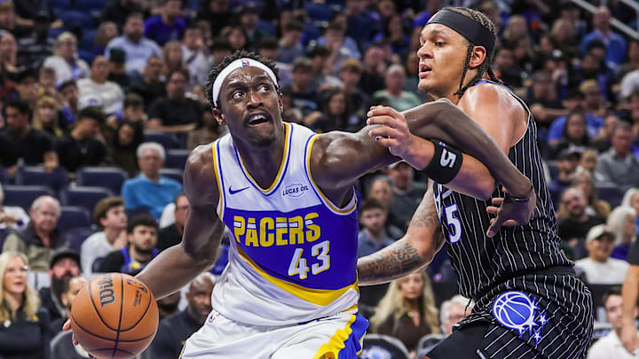 Jan 4, 2026; Orlando, Florida, USA; Indiana Pacers forward Pascal Siakam (43) drives to the basket against Orlando Magic forward Paolo Banchero (5) during the second half at Kia Center. Mandatory Credit: Mike Watters-Imagn Images