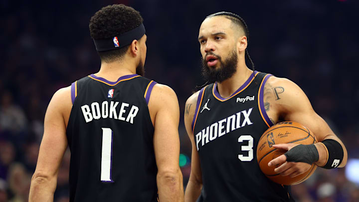 Apr 14, 2026; Phoenix, Arizona, USA; Phoenix Suns forward Dillon Brooks (3) with guard Devin Booker (1) against the Portland Trail Blazers in the first half during the play-in rounds of the 2026 NBA Playoffs at Mortgage Matchup Center. Mandatory Credit: Mark J. Rebilas-Imagn Images
