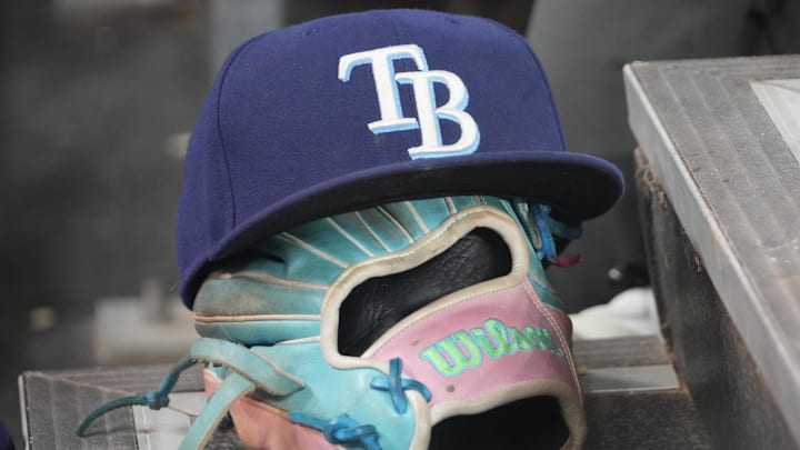 Sep 26, 2025; Toronto, Ontario, CAN; The hat and glove of Tampa Bay Rays third baseman Junior Caminero (13) in the dugout during the game against the Toronto Blue Jays at Rogers Centre. 