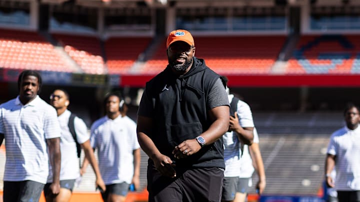 Florida Gators assistant coach for defensive line Gerald Chatman smiles with Florida Gators wide receiver Marcus Burke (88) during Gator Walk at the Orange and Blue spring football game at Steve Spurrier Field at Ben Hill Griffin Stadium in Gainesville, FL on Saturday, April 13, 2024. [Matt Pendleton/Gainesville Sun]