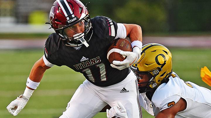 Gadsden City's Dylan Perry tries to evade the tackle of Oxford's Malik Smith during high school football action on August 21, 2026. Gadsden City's Dylan Perry tries to evade the tackle of Oxford's Malik Smith during high school football action on August 21, 2026.