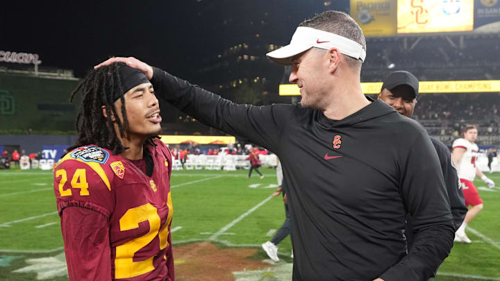 Dec 27, 2023; San Diego, CA, USA; Southern California Trojans head coach Lincoln Riley (right) celebrates with wide receiver Makai Lemon (24) after the Holiday Bowl against the Louisville Cardinals at Petco Park. Mandatory Credit: Kirby Lee-Imagn Images Dec 27, 2023; San Diego, CA, USA; Southern California Trojans head coach Lincoln Riley (right) celebrates with wide receiver Makai Lemon (24) after the Holiday Bowl against the Louisville Cardinals at Petco Park. Mandatory Credit: Kirby Lee-Imagn Images