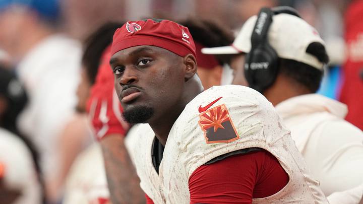 Arizona Cardinals running back Jeremiyah Love (4) looks on from the sideline as they play the Seattle Seahawks at State Farm Stadium in Glendale on Sept. 20, 2026.