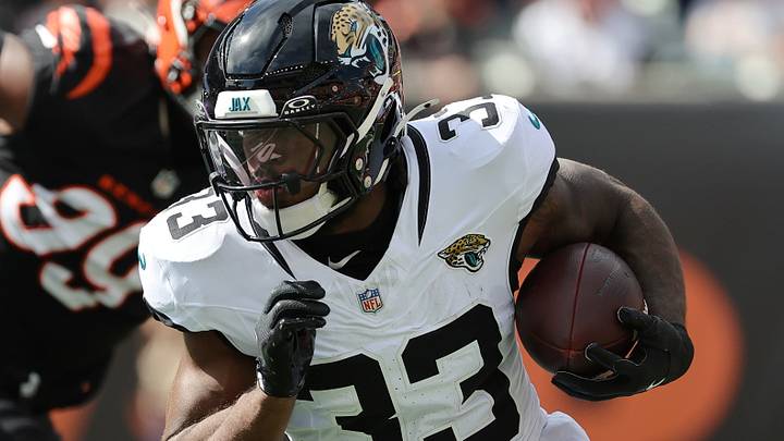 Oct 4, 2026; Cincinnati, Ohio, USA;  Jacksonville Jaguars running back Bhayshul Tuten (33) runs with the ball during the first quarter against the Cincinnati Bengals at Paycor Stadium.  Mandatory Credit: Joseph Maiorana-Imagn Images