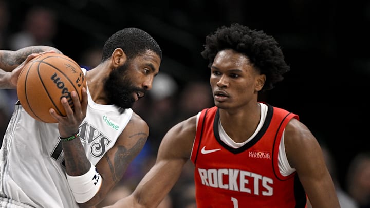 Feb 8, 2025; Dallas, Texas, USA; Dallas Mavericks guard Kyrie Irving (11) and Houston Rockets forward Amen Thompson (1) in action during the game between the Dallas Mavericks and the Houston Rockets at the American Airlines Center. Mandatory Credit: Jerome Miron-Imagn Images