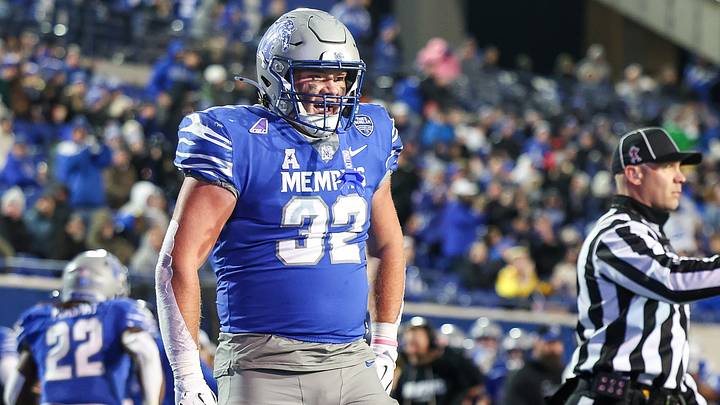 Memphis Tigers tight end Matt Adcock (32) celebrates after a touchdown against the Navy Midshipmen during the first half at Simmons Bank Liberty Stadium. Memphis Tigers tight end Matt Adcock (32) celebrates after a touchdown against the Navy Midshipmen during the first half at Simmons Bank Liberty Stadium.