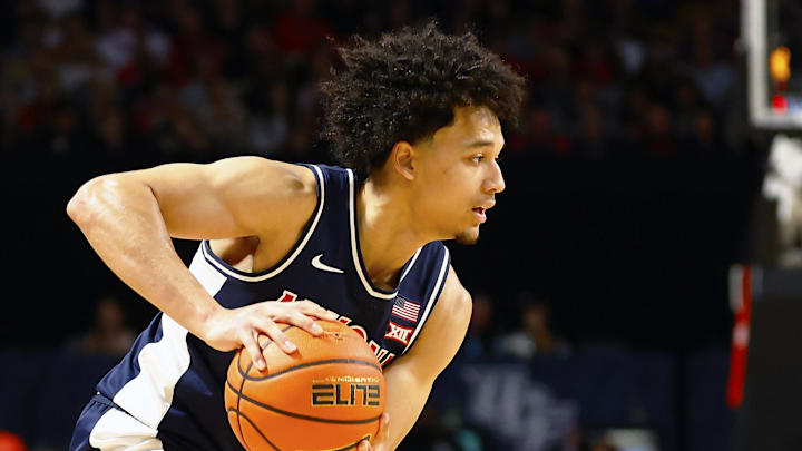 Jan 17, 2026; Orlando, Florida, USA;  Central Florida Knights guard Riley Kugel (2) defends Arizona Wildcats guard Brayden Burries (5) in the second half at Addition Financial Arena. Mandatory Credit: Russell Lansford-Imagn Images