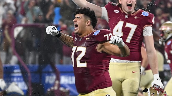 Dec 2, 2023; Charlotte, NC, USA; Florida State Seminoles offensive lineman Julian Armella (72) and tight end Jimmy Casey (47) celebrate winning the ACC Championship against the Louisville Cardinals at Bank of America Stadium. Mandatory Credit: Bob Donnan-Imagn Images