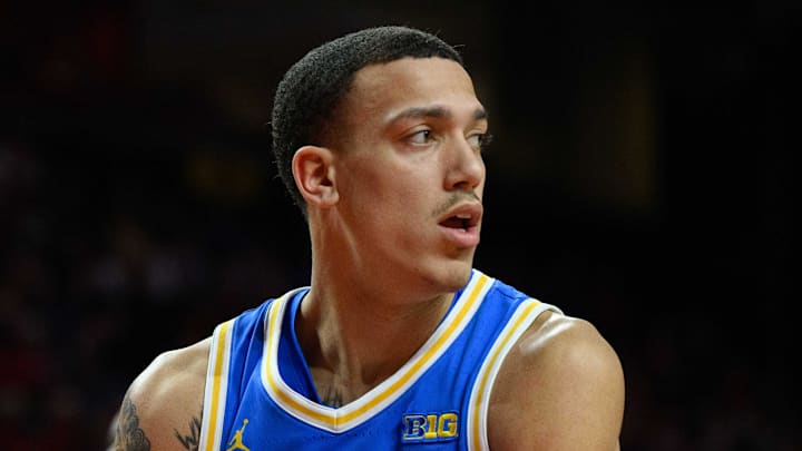 Jan 10, 2025; College Park, Maryland, USA; UCLA Bruins guard Kobe Johnson (0) grabs a rebound during the first half against the Maryland Terrapins at Xfinity Center. Mandatory Credit: Reggie Hildred-Imagn Images