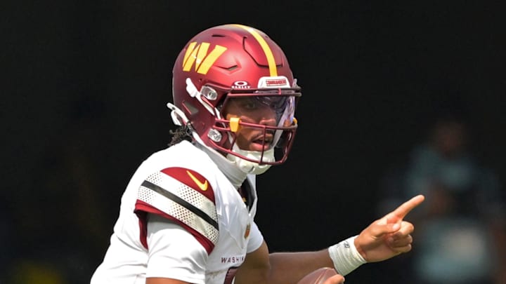 Oct 5, 2025; Inglewood, California, USA; Washington Commanders quarterback Jayden Daniels (5) looks to pass against the Los Angeles Chargers at SoFi Stadium. Mandatory Credit: Jayne Kamin-Oncea-Imagn Images