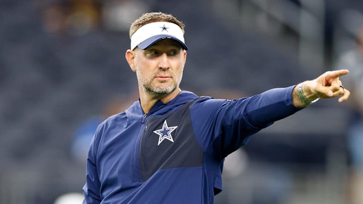 Aug 22, 2025; Arlington, Texas, USA; Dallas Cowboys head coach Brian Schottenheimer gives directions prior to the game against the Atlanta Falcons at AT&T Stadium. Mandatory Credit: Andrew Dieb-Imagn Images