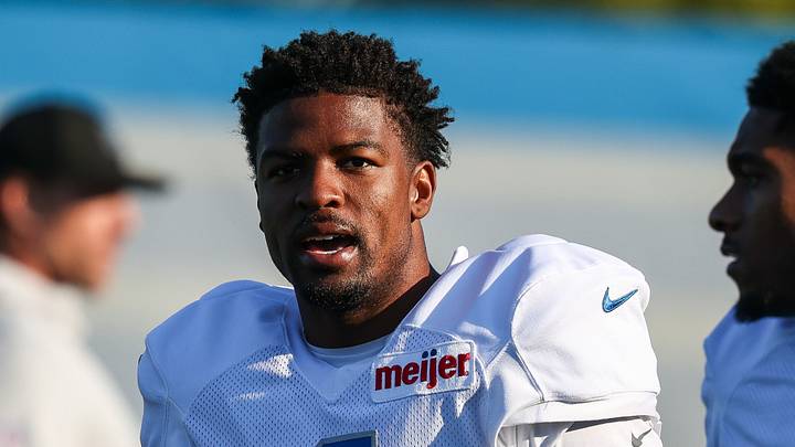 Aug 3, 2026; Allen Park, MI, USA;  Detroit Lions cornerback D.J. Reed (4) talks with defensive back Christian Izien (27) when walking onto the field before Detroit Lions training camp. Mandatory Credit: Paul Barnick-Imagn Images