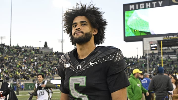 Nov 22, 2025; Eugene, Oregon, USA; Oregon Ducks quarterback Dante Moore (5) walks off the field after the game against the Southern California Trojans at Autzen Stadium. Mandatory Credit: Troy Wayrynen-Imagn Images Nov 22, 2025; Eugene, Oregon, USA; Oregon Ducks quarterback Dante Moore (5) walks off the field after the game against the Southern California Trojans at Autzen Stadium. Mandatory Credit: Troy Wayrynen-Imagn Images