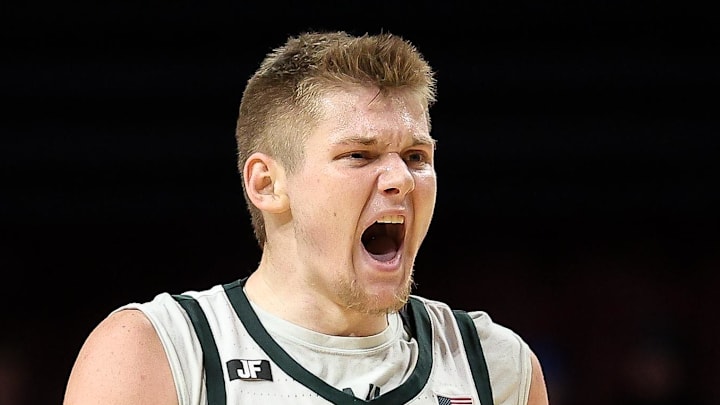 Dec 4, 2024; Minneapolis, Minnesota, USA; Michigan State Spartans forward Jaxon Kohler (0) celebrates his three-point basket against the Minnesota Golden Gophers during the second half at Williams Arena.
